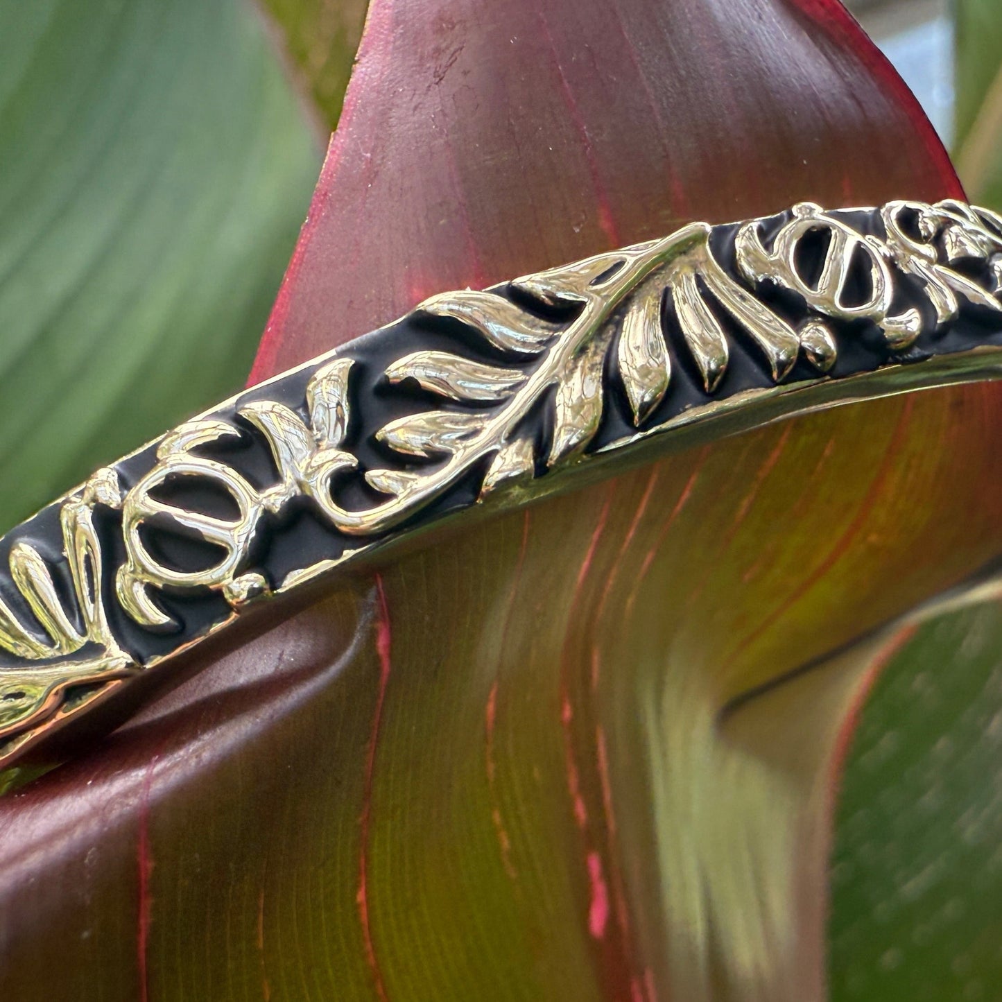 Decorative bangle on a plant with green leaves