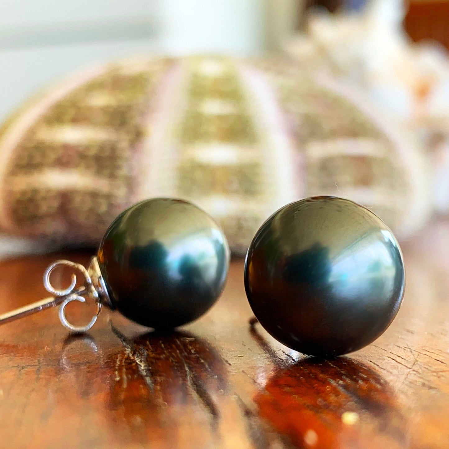 Black 12mm shell pearls with sterling silver posts.