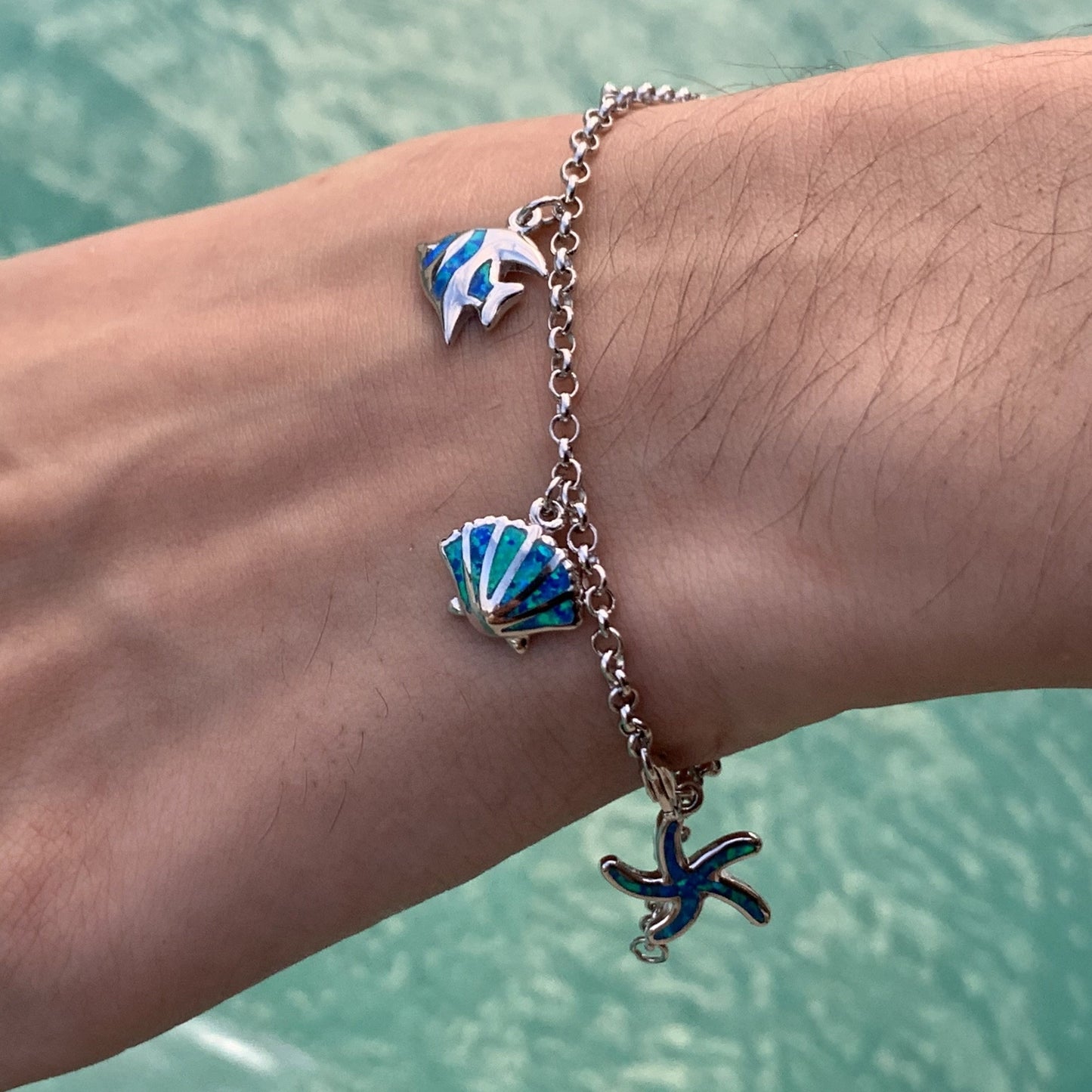 Sea life charm bracelet on model.