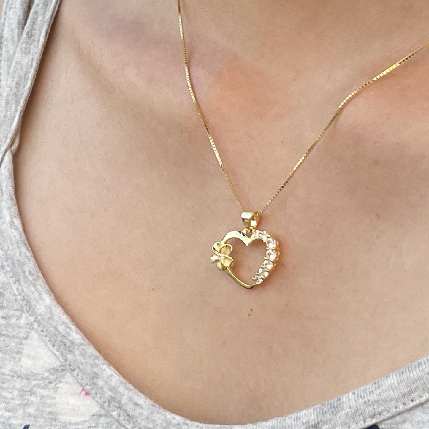 Gold Plated Plumeria Open Heart Pendant with Cubic Zirconia on Model