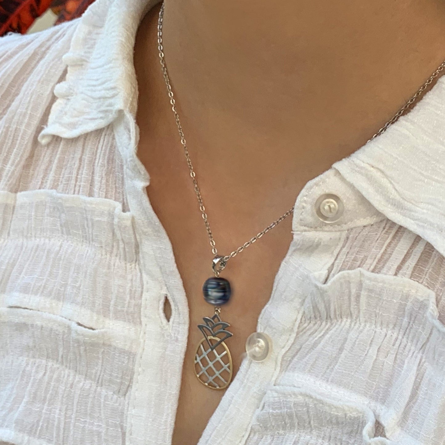 Close up of Pineapple Pearl Tricolor Necklace with black pearl.