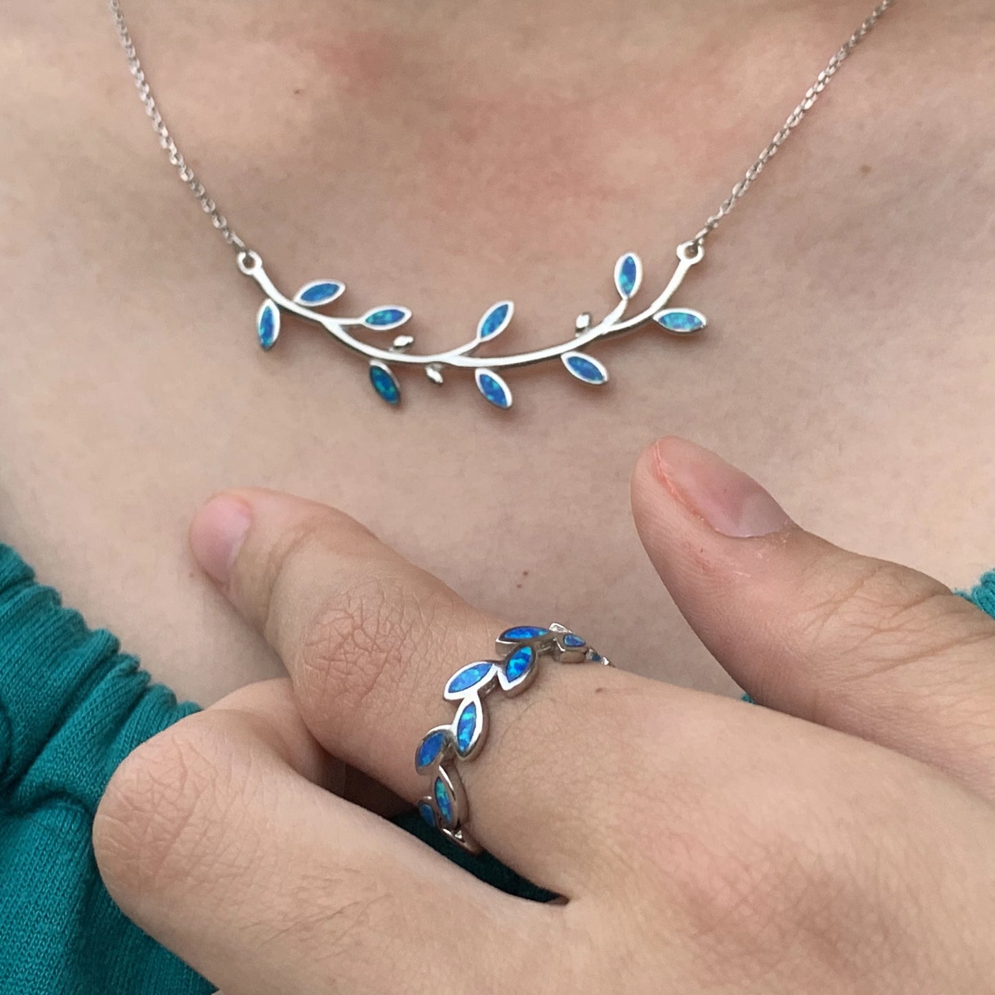 Maile Opalite Lei Ring closeup with matching necklace on model