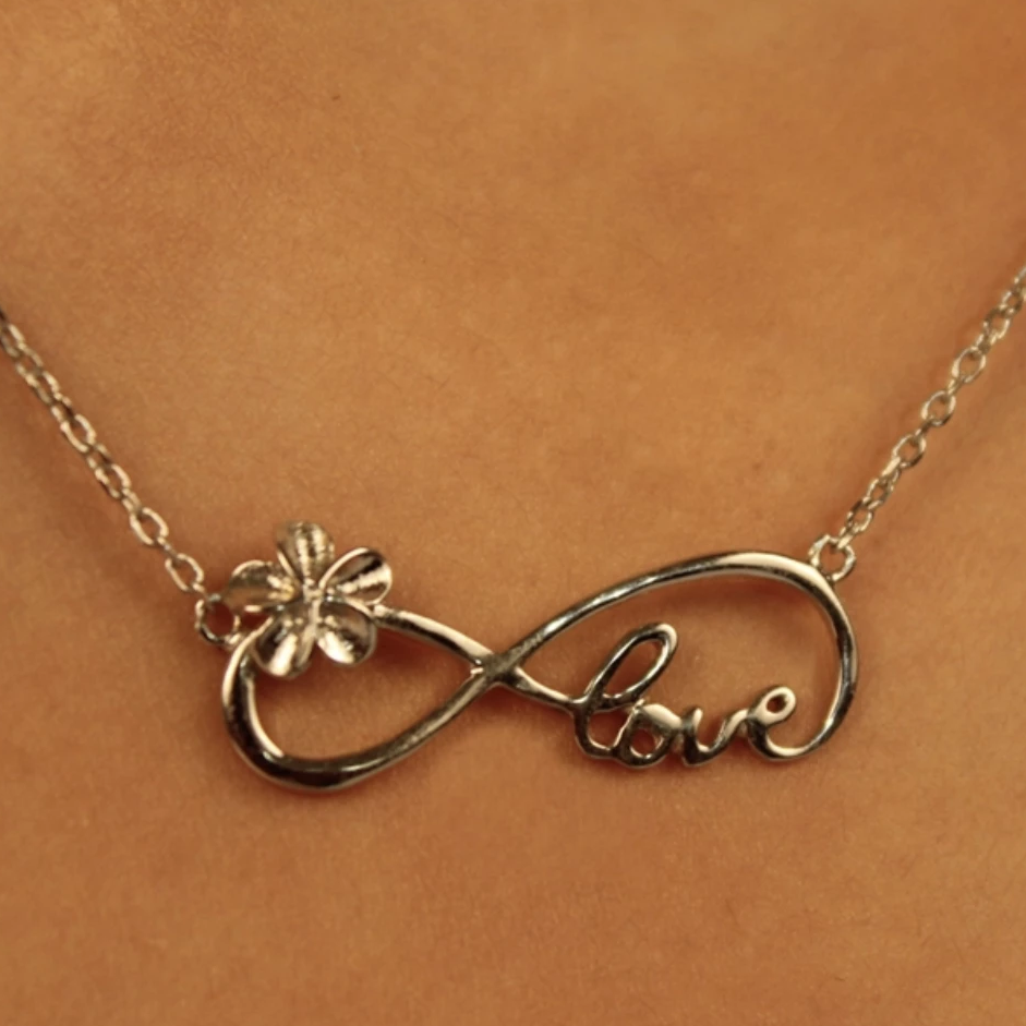 Plumeria Infinity Love Pendant Closeup on Model