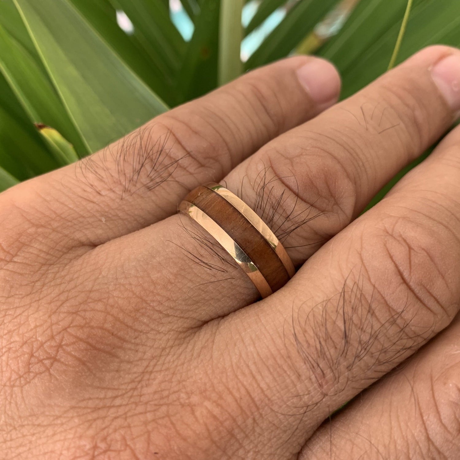 Close up of Koa 14K Gold Plated over Stainless Steel Ring on model.