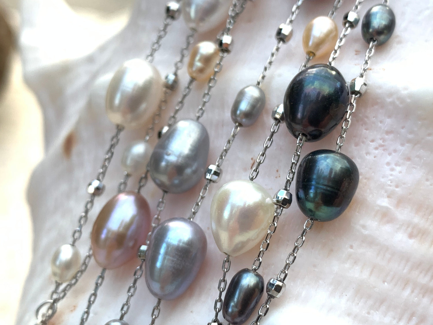 Close up of Dew drop freshwater pearl necklaces with 36" chain length.