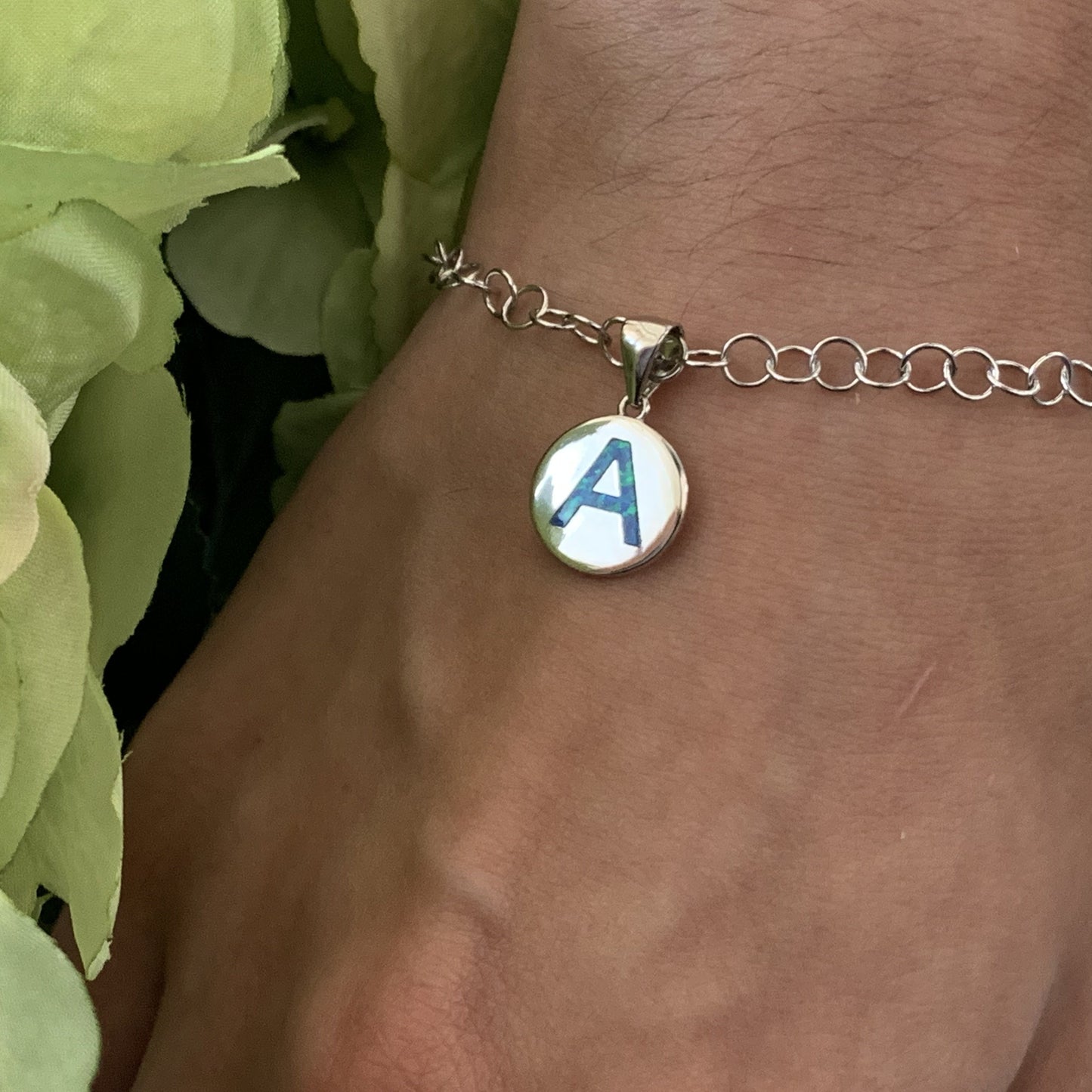Opalite charm pendant on model shown as a charm bracelet.