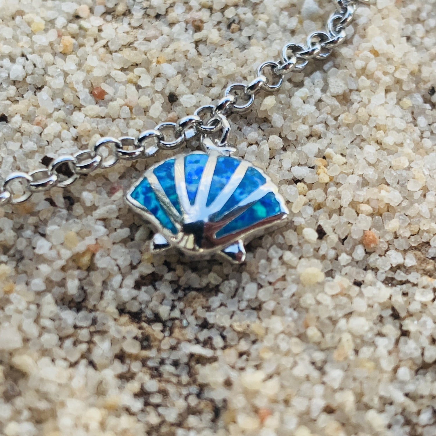 Sea life charm bracelet showing shell charm.