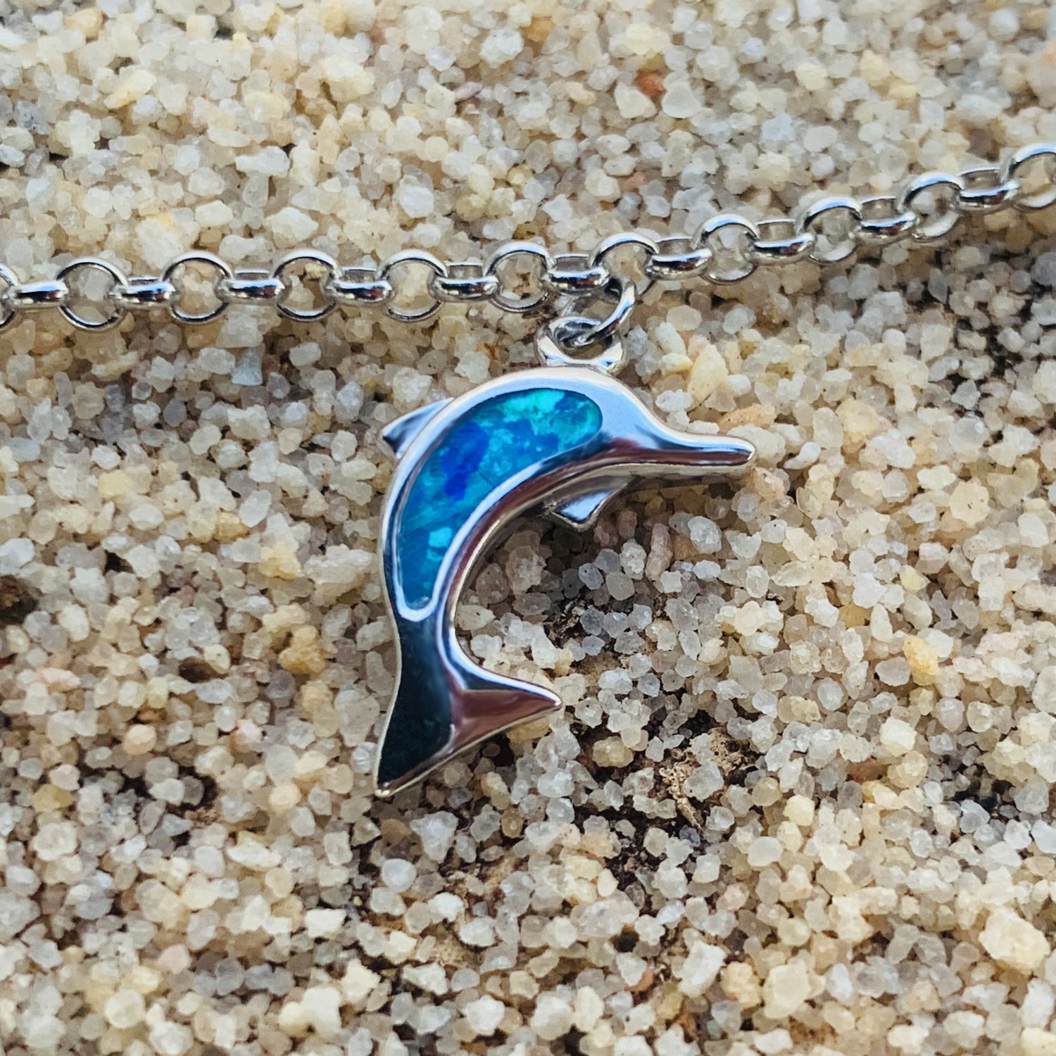 Sea life charm bracelet showing dolphin charm.