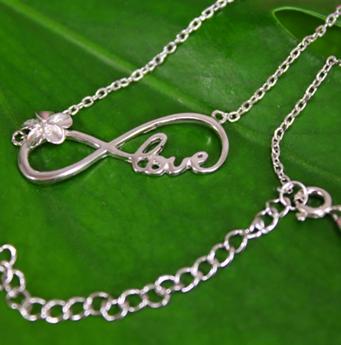 Plumeria Infinity Love Pendant Closeup with chain extension